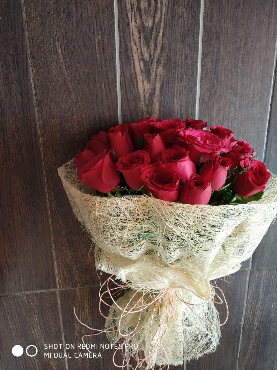 send flower Pitampura DelhiRed Roses in Jute