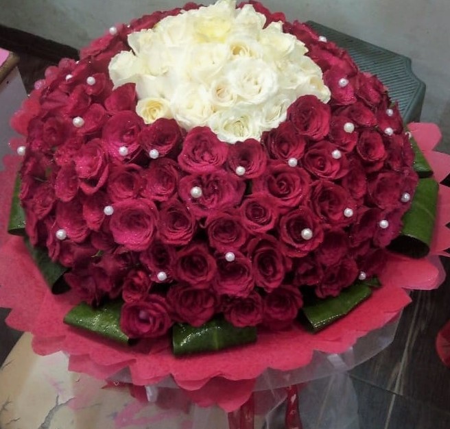 send flower Palam VillageRed & White Rose in Paper Wrapping