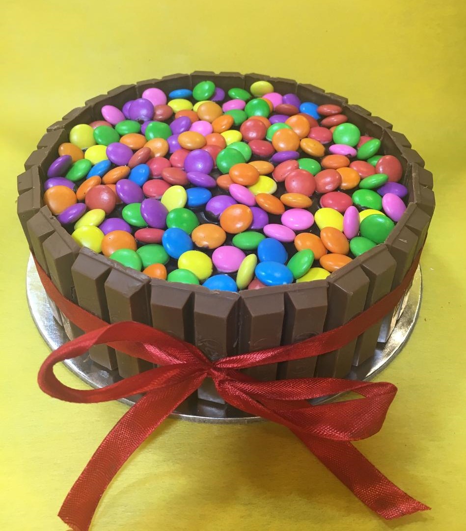 send flower Palam Village1Kg Kitkat Gems Cake